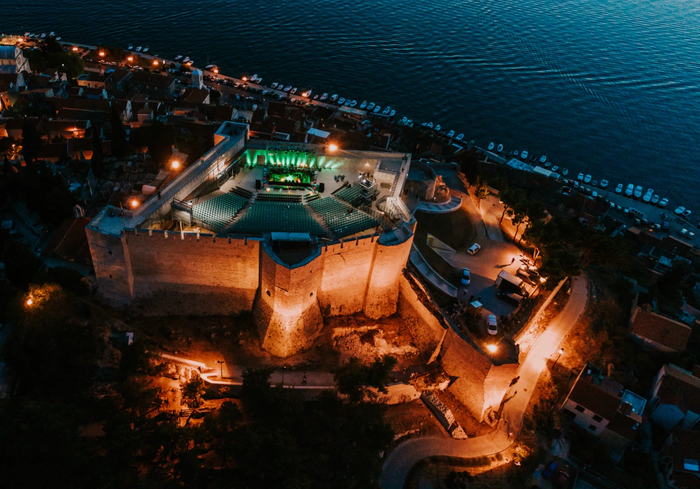 shows a castle seen from above at night