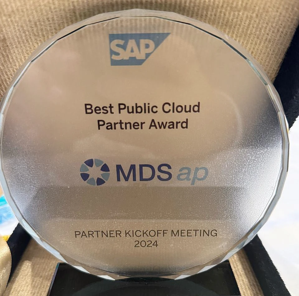 Glass disc trophy with the words Best Public Cloud Partner and MDS ap prominent on it