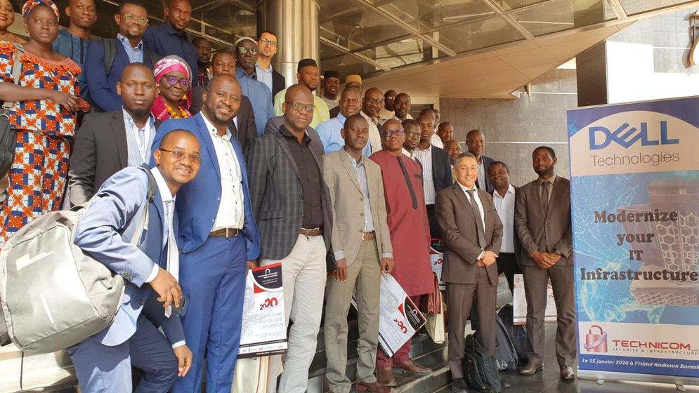 group photo of people at a conference smiling at the camera