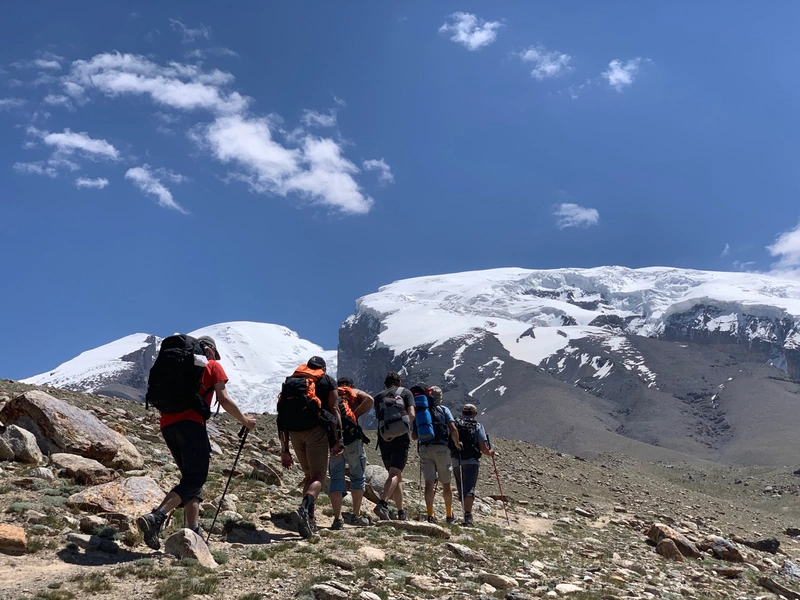 Maxime: 'The closer to Caesar, the greater the fear.' Trekking to Base Camp at 4,400m with the imposing 7,546m Mustagh Ata and its 'Father of Ice Mountains’ glaciers constantly in sight