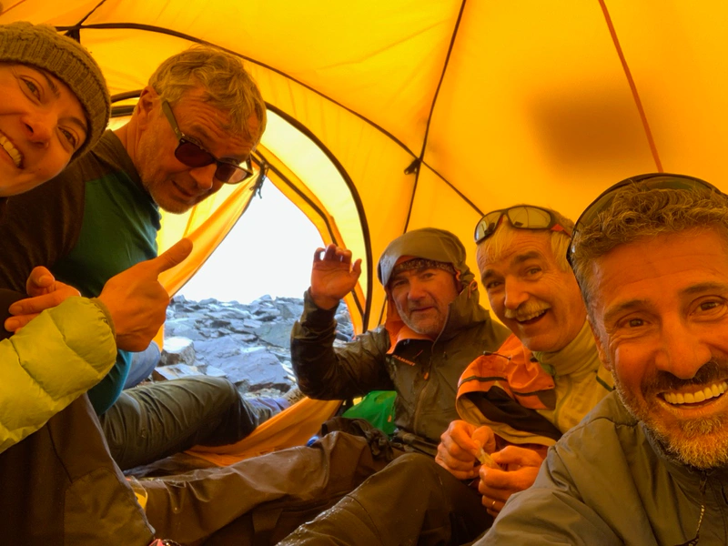 Maxime: Crammed, cold and wet but happy! Sonia, Eric, Mouss, Pascal and I visibly happy sheltering inside the 3-man tent while the sudden snow storm rages outside. "Let it snow, let it snow…"