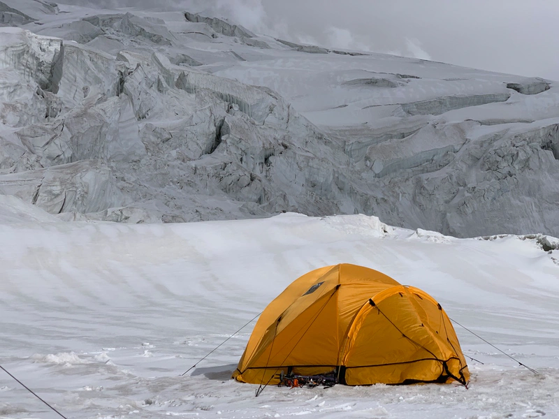 Maxime: Our little home away from home. The relative comfort of our flimsy tent at Advance Camp One is magnified by the proximity of the Mustagh Ata seracs and gaping crevasses nearby.