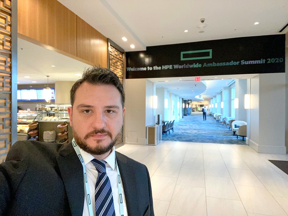 A man in a suit and tie is seen in a selfie photograph