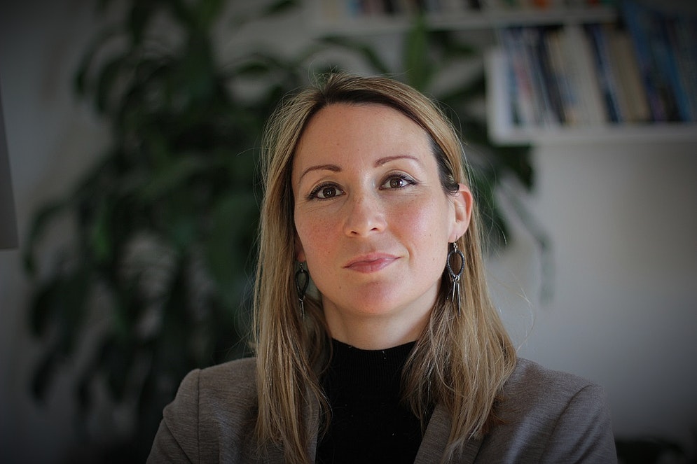 head and shoulders photo of a woman in a business suit