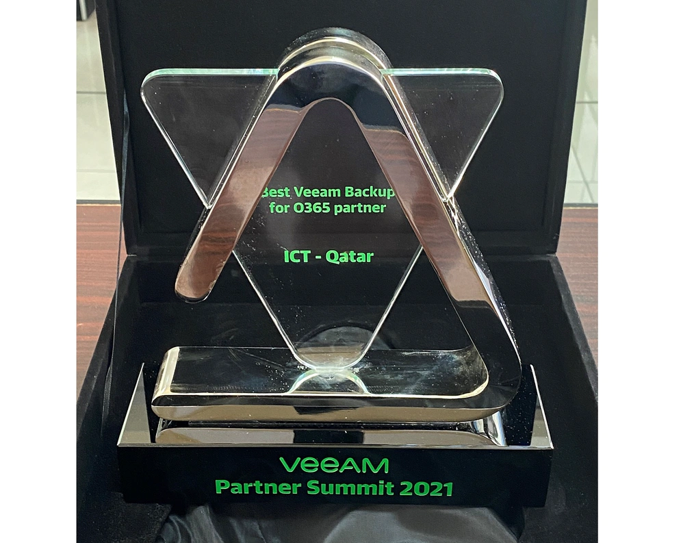 a glass and metal award trophy