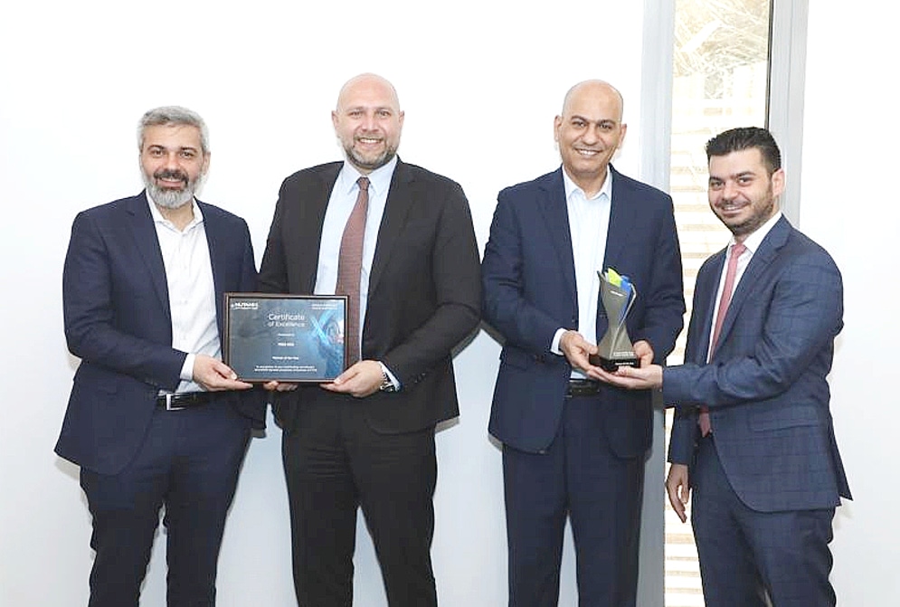 four men in suits holding an award and a certificate