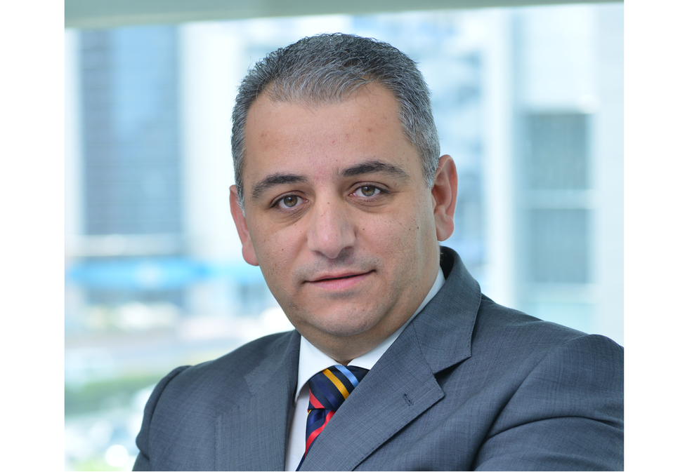 head and shoulders photo of a man in a suit