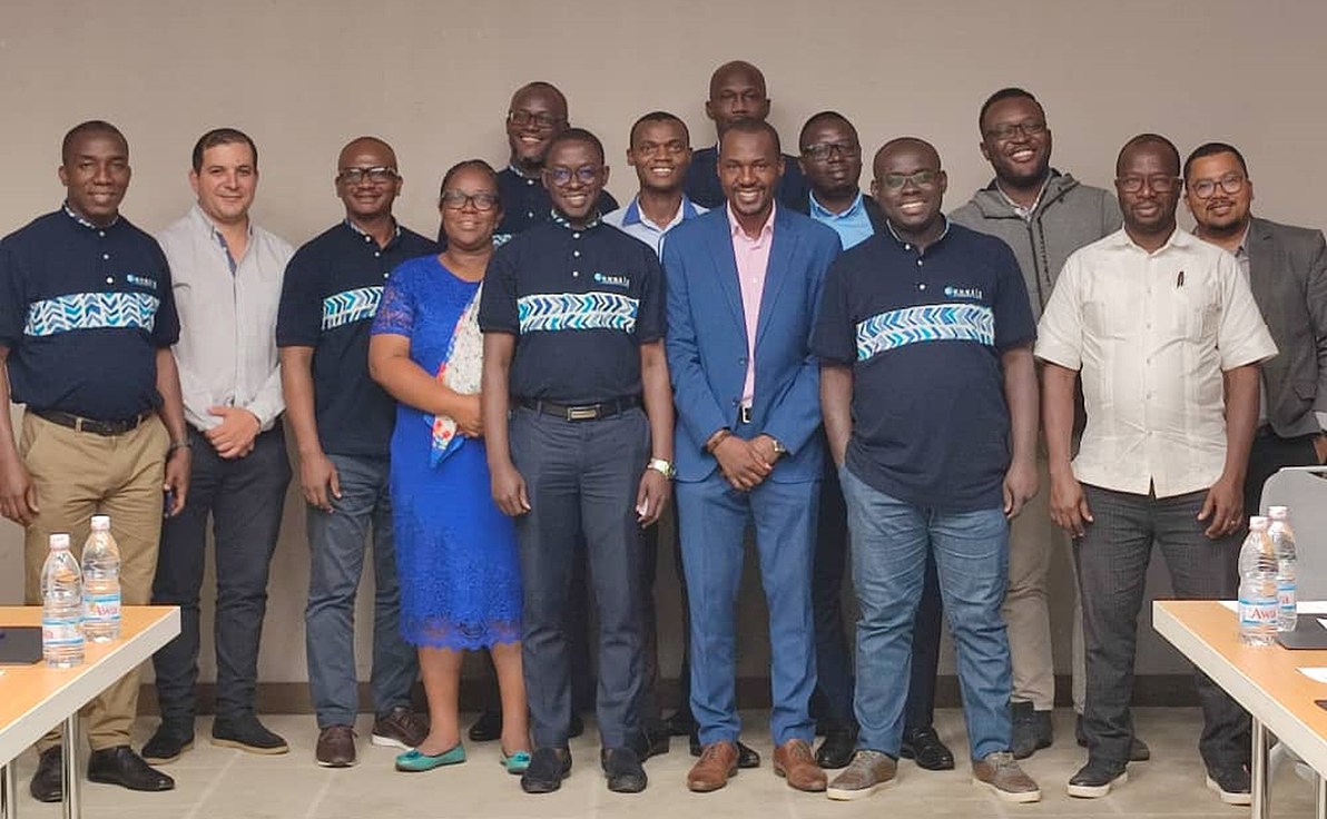 a group of people facing the camera are all smiling for the photographer