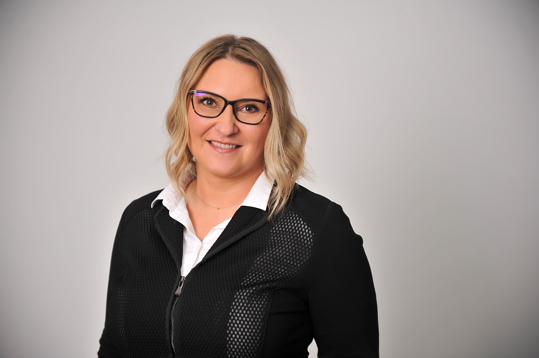 formal head and shoulders portrait of a female executive