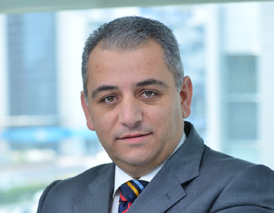 head and shoulders photo of a man in a suit