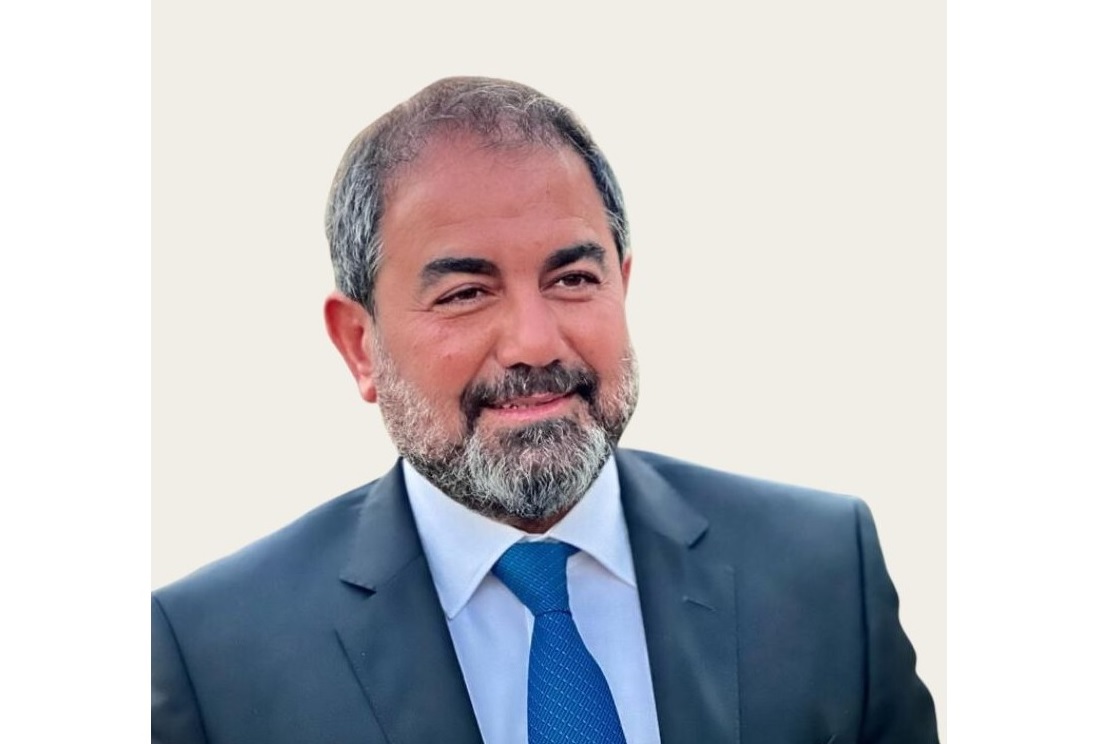 head and shoulders view of a man in a suit and tie