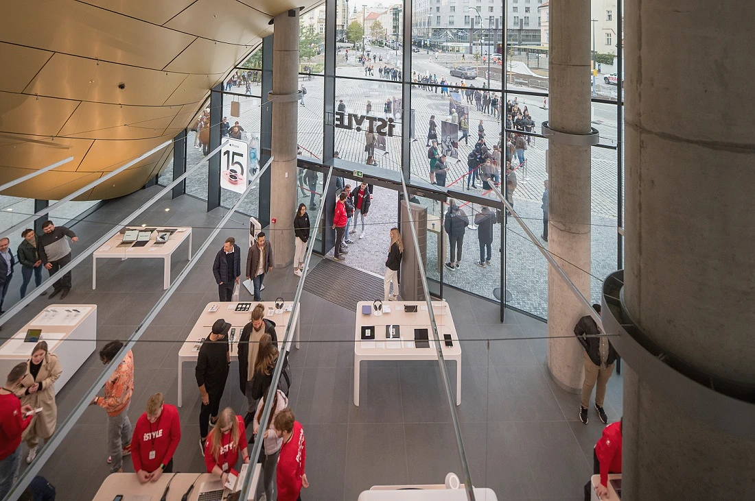 shows the interior of a hi tech retail site, seen from above, looking down at the shop floor