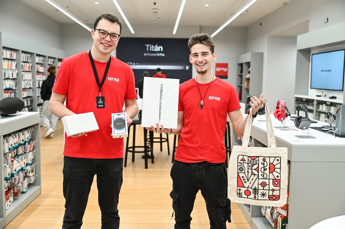 two men seen in red t shirts in a hi tech shop