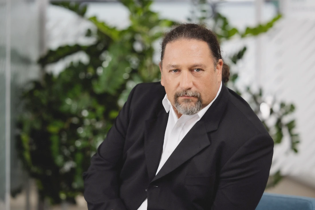 head and shoulders photo of a man in a suit