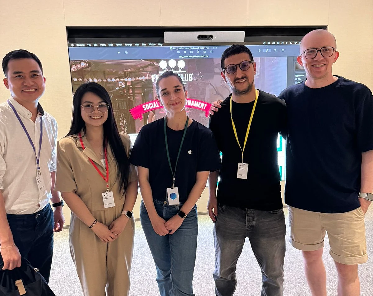 five people in a friendly group photo