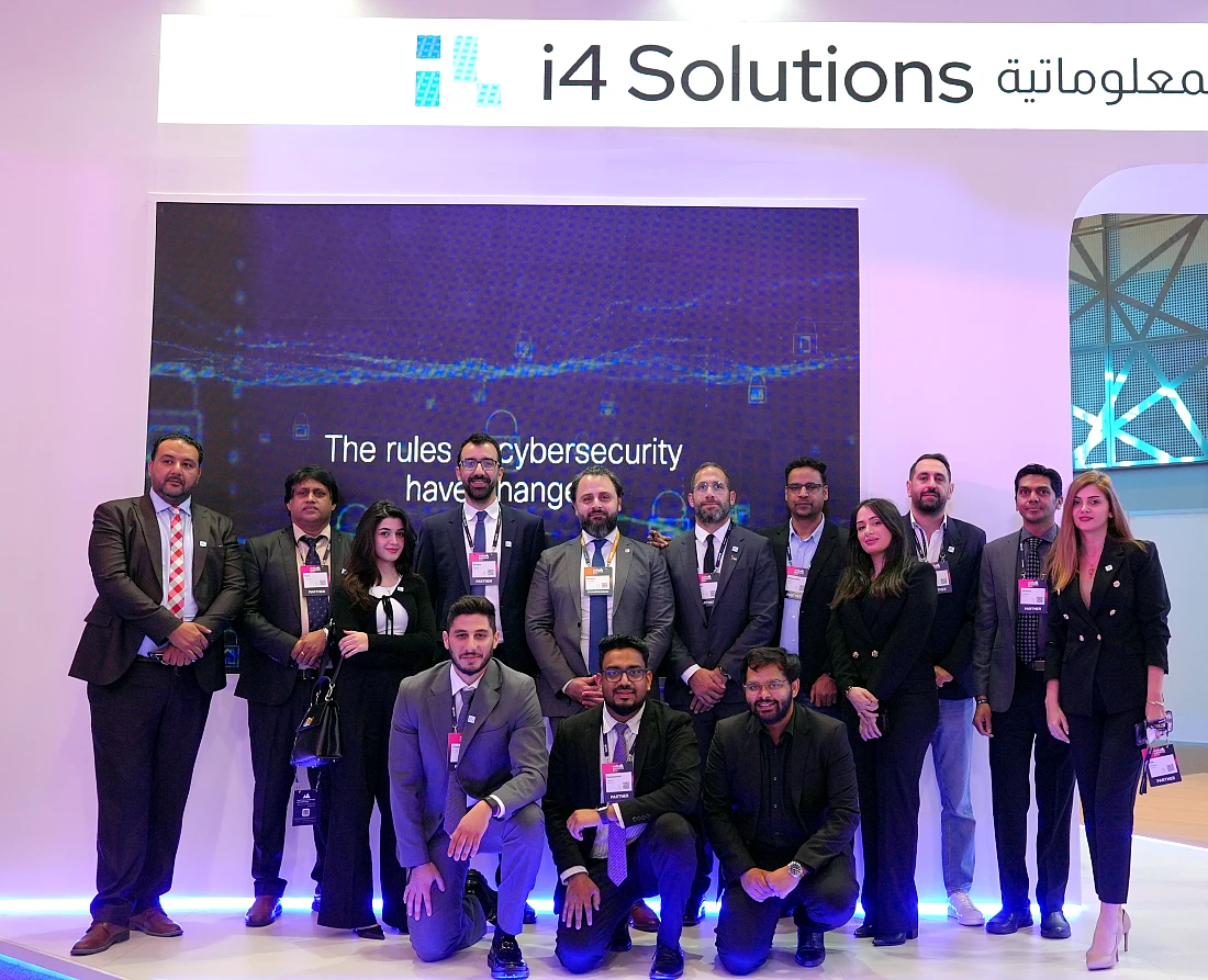 a group of people are seen at an IT exhibition in a group photograph 
