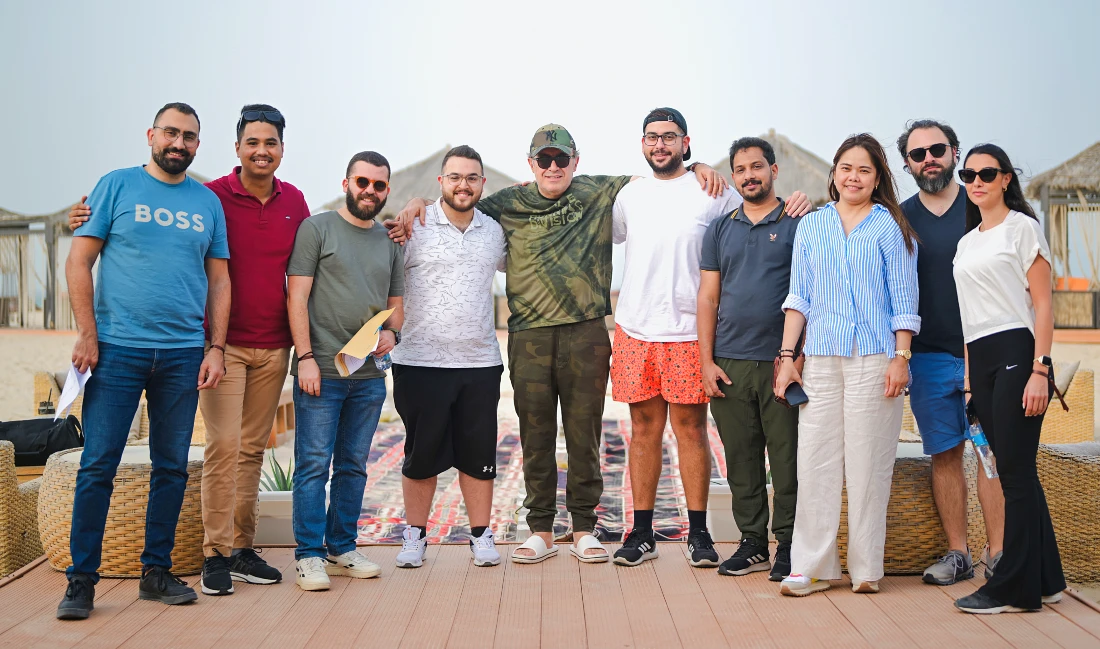 ten people seen together in an informal group photograph