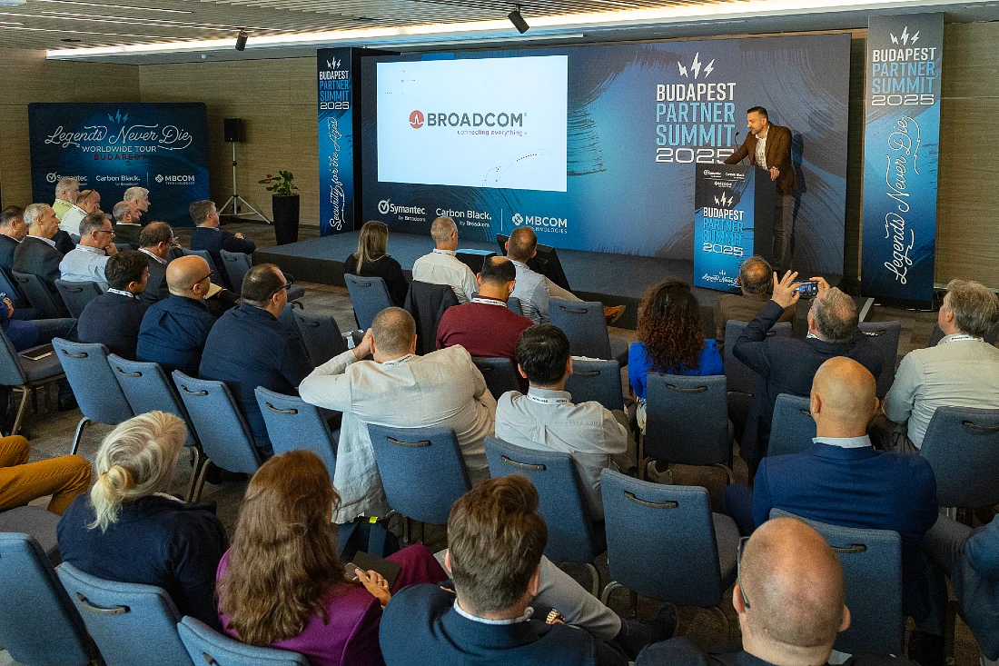 A man presents to a roomful of people at a hi tech event