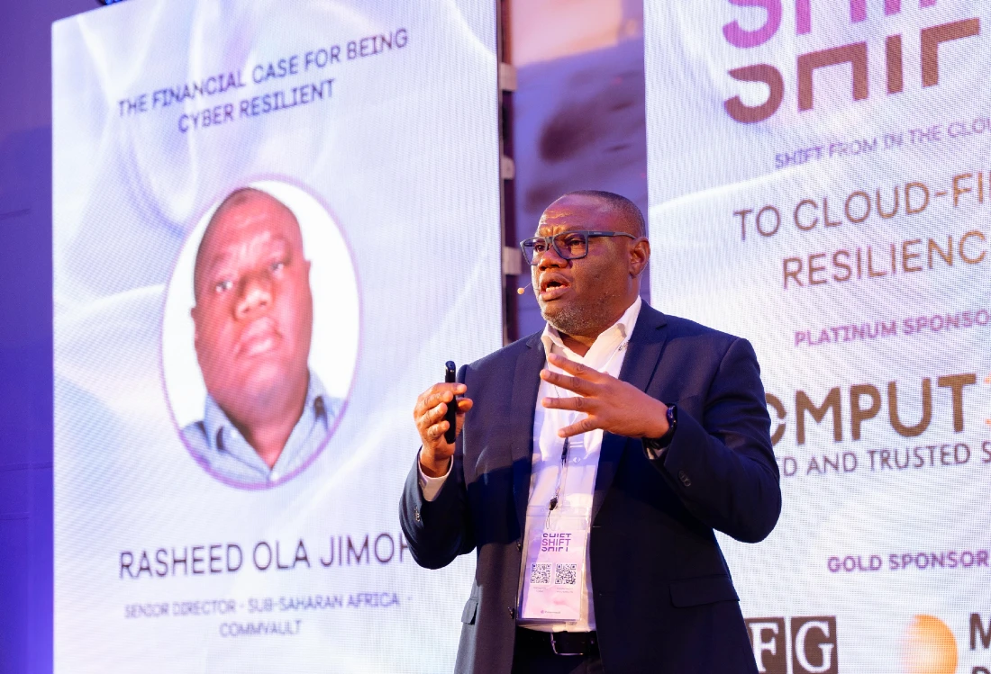 a man speaks to an audience at a hi tech event
