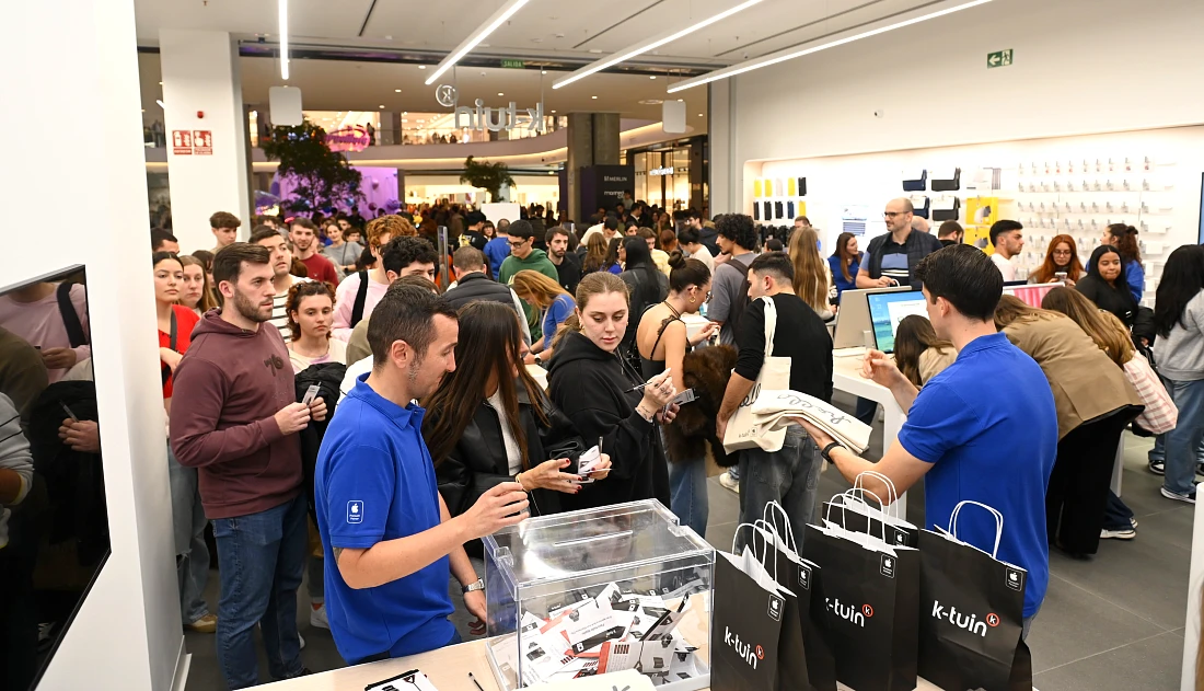 A busy scene in a hi tech store as customers arrive to redeem special offer vouchers