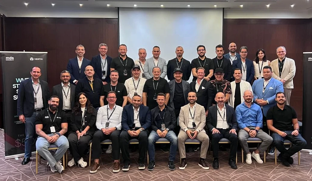 a group photo of executives at a hi tech event