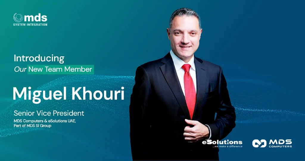 a man in a suit and tie is seen in a photograph with text announcing his appointment as Senior Vice President of MDS Computers and eSolutions UAE