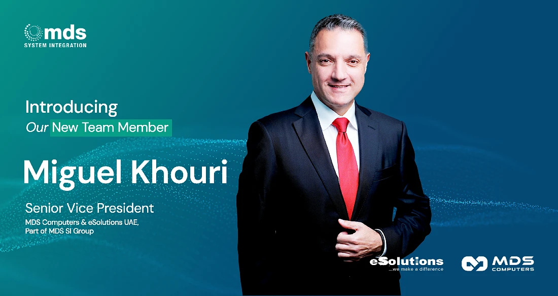 a man in a suit and tie is seen in a photograph with text announcing his appointment as Senior Vice President of MDS Computers and eSolutions UAE