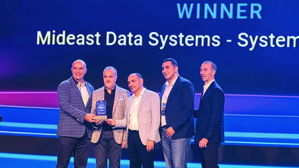 five men are seen on stage accepting an award at a hi tech event