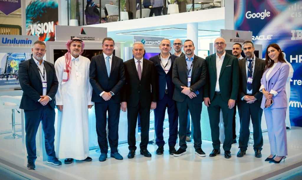 Eleven people seen in a group photograph at a hi tech event